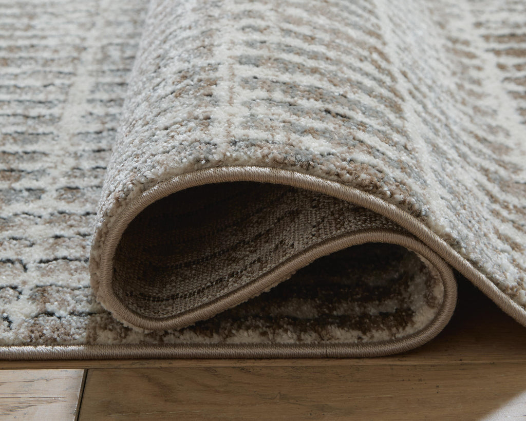 Fuadwick 5'3" x 7' Area Rug